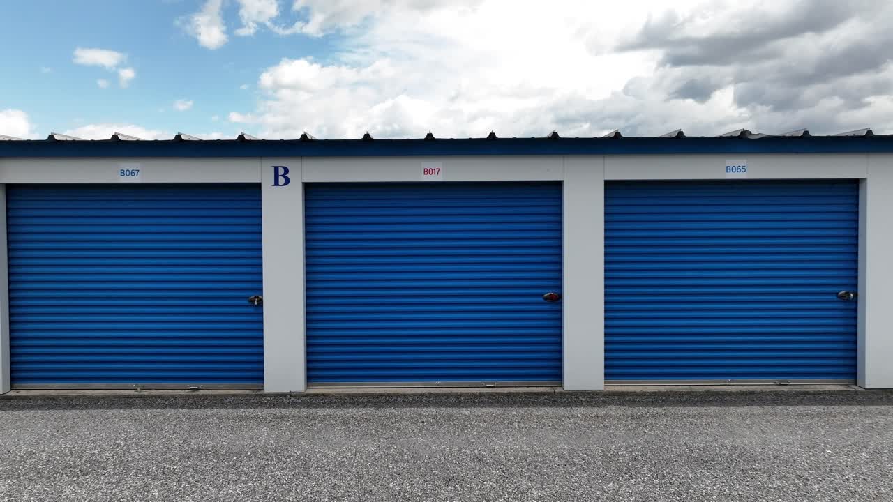 Blue Self-Storage Units Under a Cloudy Sky