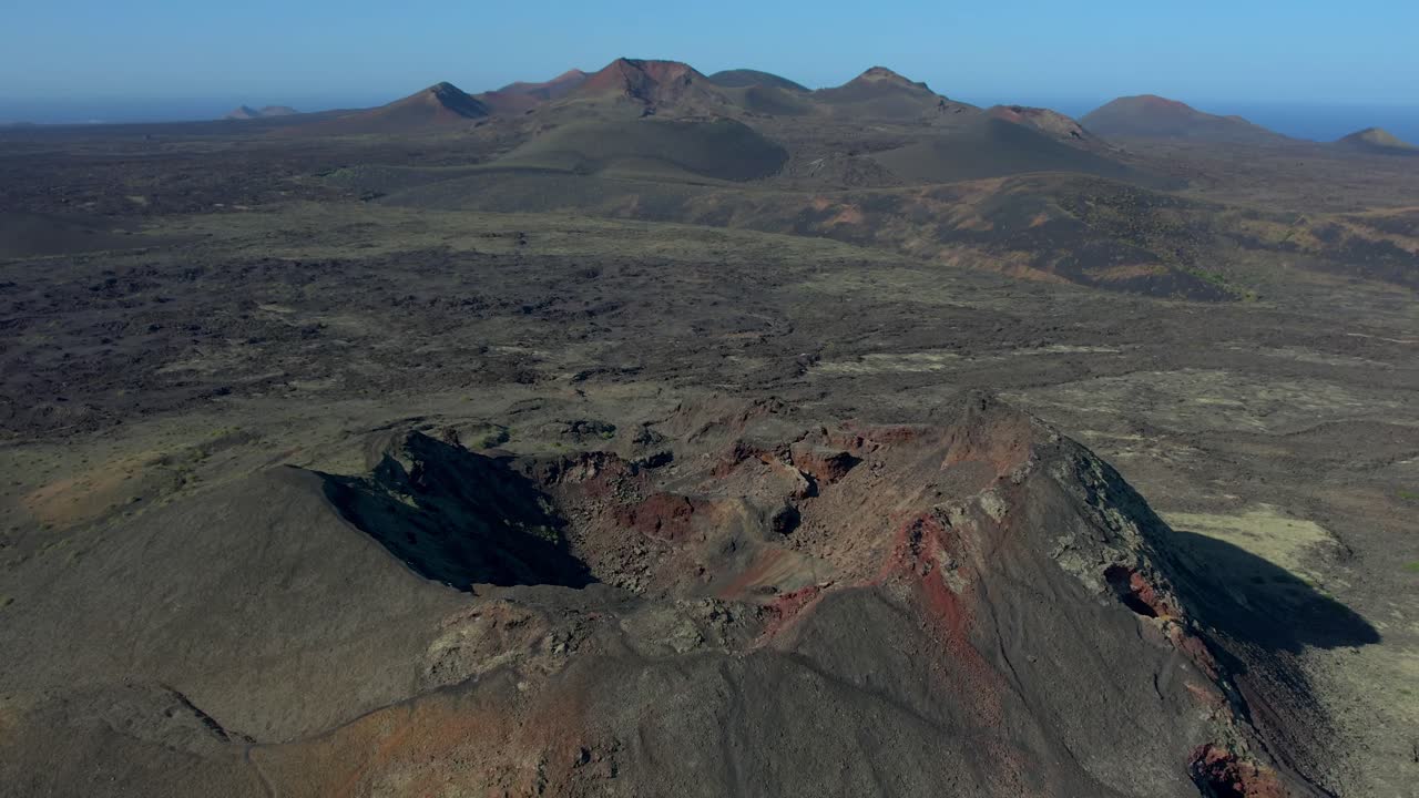 Aerial drone view of mountain sea and volcanoes in Lanzarote, Canary Islands, Spain