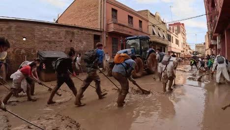 community cleanup efforts after devastating flood in spain