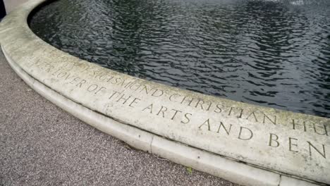 close-up of a stone fountain inscription