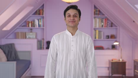 happy indian man smiling in traditional outfit