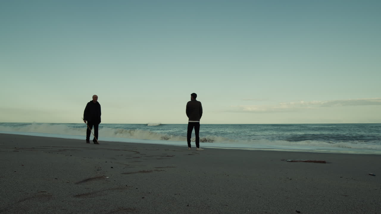 Celebrating Father's Day With Son on the Beach Near the Sea at Sunset