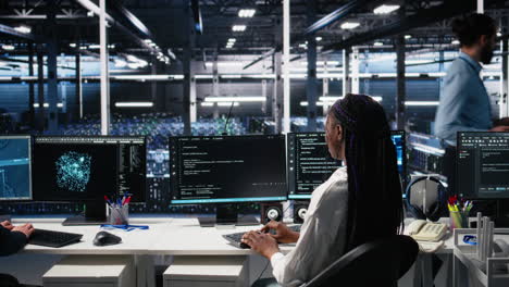 data center female programmer uses machine learning algorithms to analyze datasets