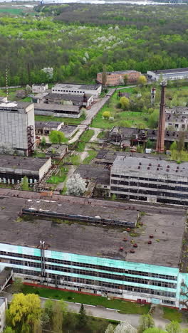 empty apocalipse city with damaged houses. aerial view of ruined abandoned building. vertical video