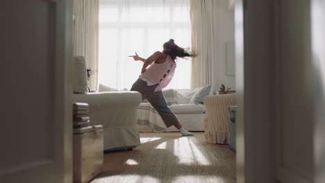 happy young woman dancing at home having fun celebrating with funny dance moves enjoying freedom on weekend morning 4k footage