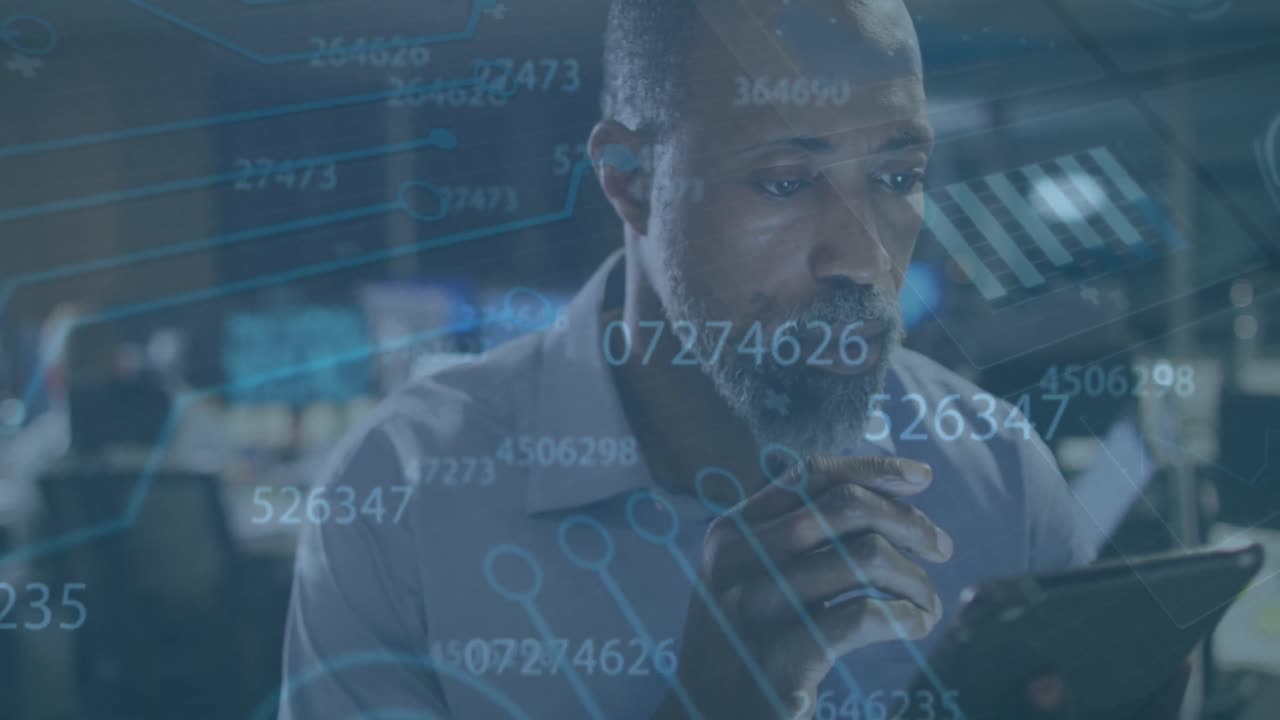 Animation of data processing over african american businessman using tablet