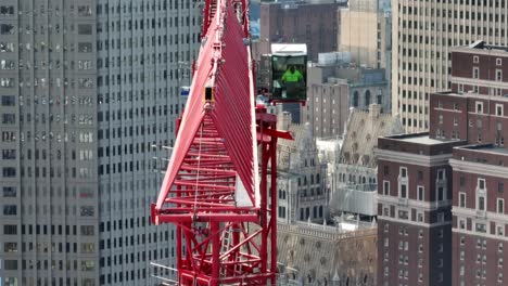 Tower-crane-in-operation-at-construction-site-of-downtown-skyscraper-in-America