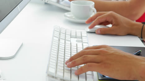 close-up-of-young-female-creative-designer-working-on-computer-