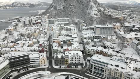 overflight of the center of ålesund covered in snow