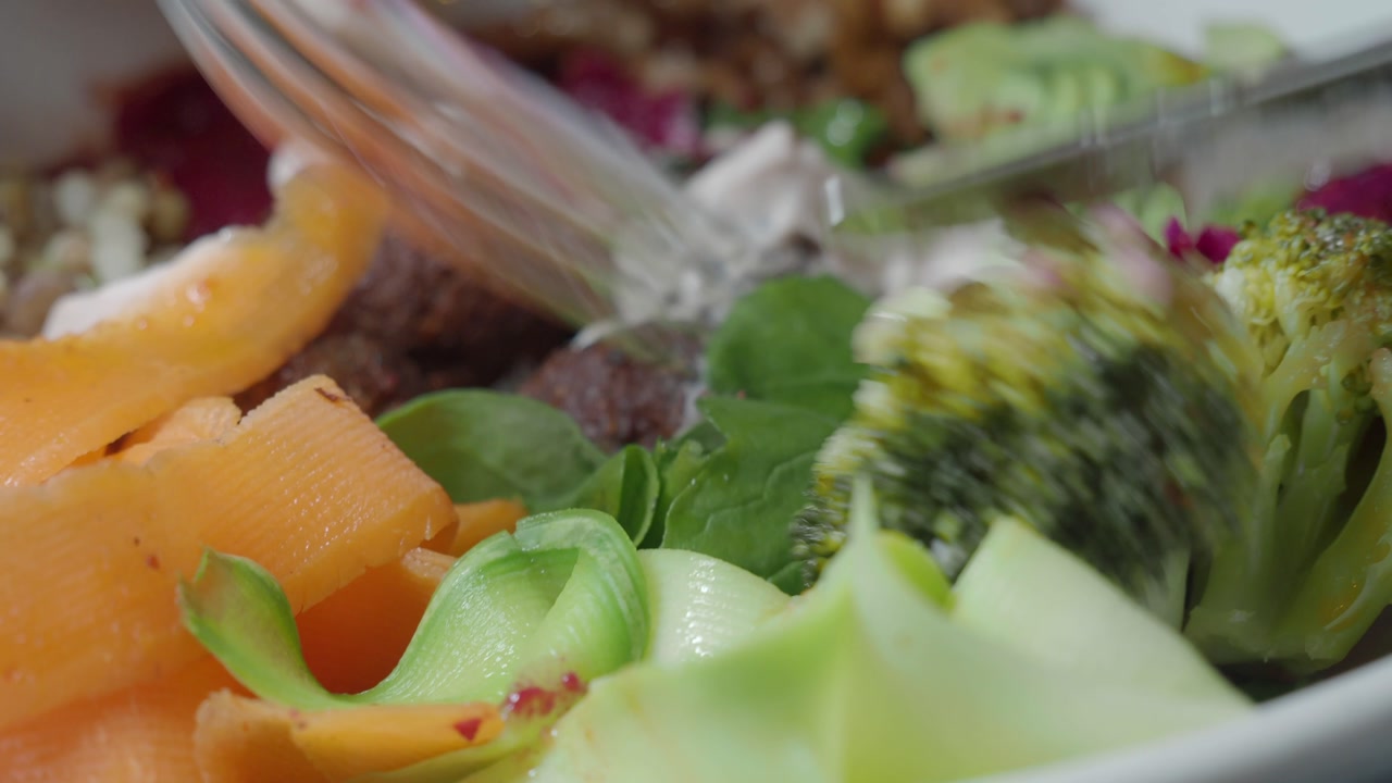 Close-up of a Healthy and Colorful Salad Being Eaten