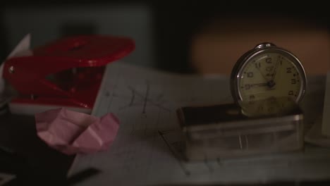 desk with papers, clock, and stationery