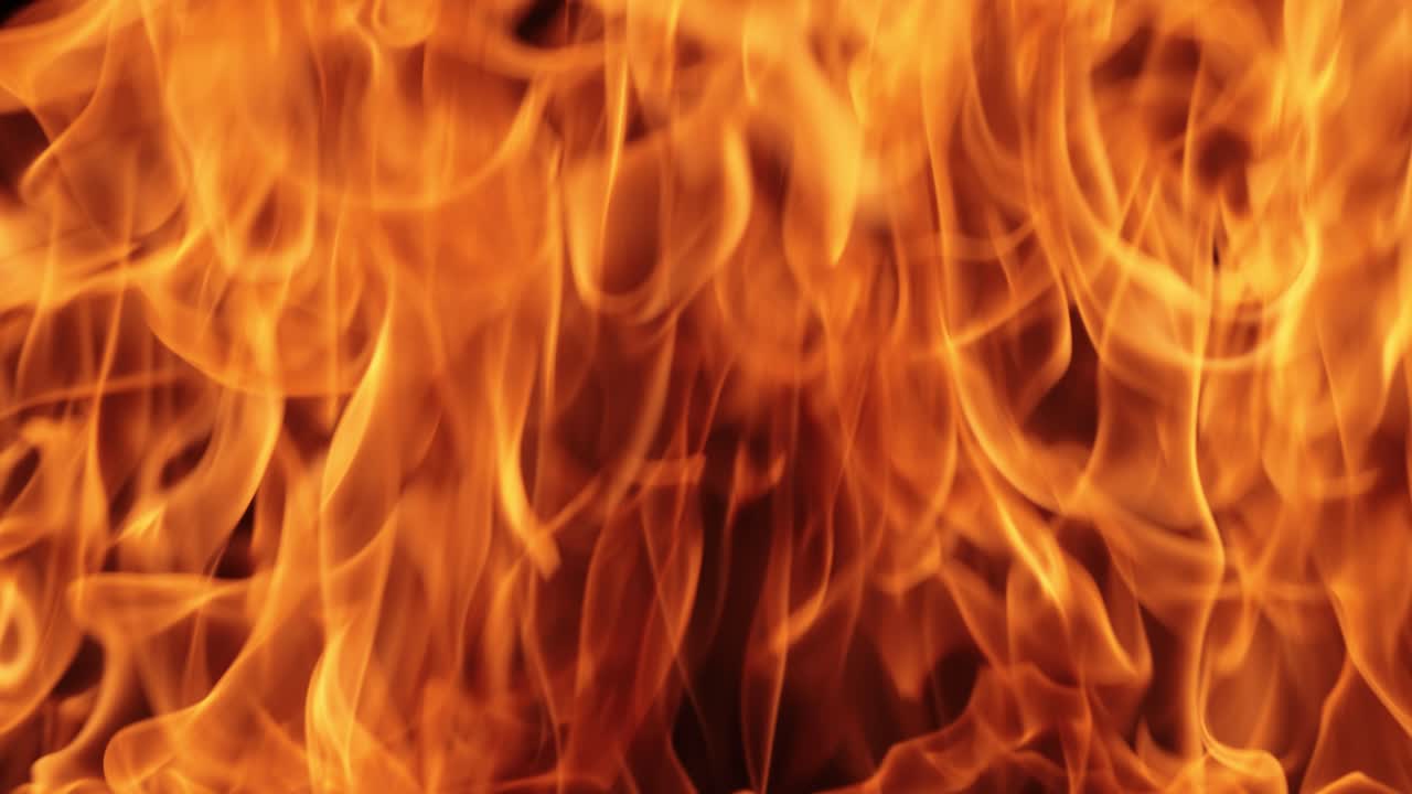 Flames of fire on black background in slow motion