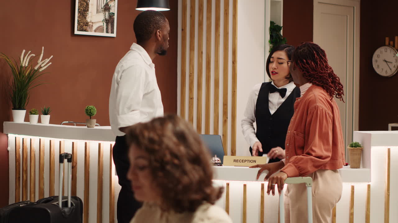 Guests and receptionist chatting