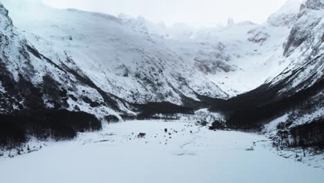 A-panoramic-view-from-above-of-the-majestic-snow-covered-Patagonian-landscape,-with-imposing-mountains