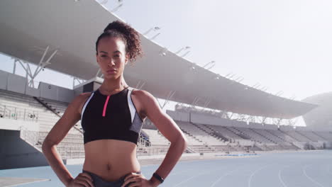 female athlete posing on a track