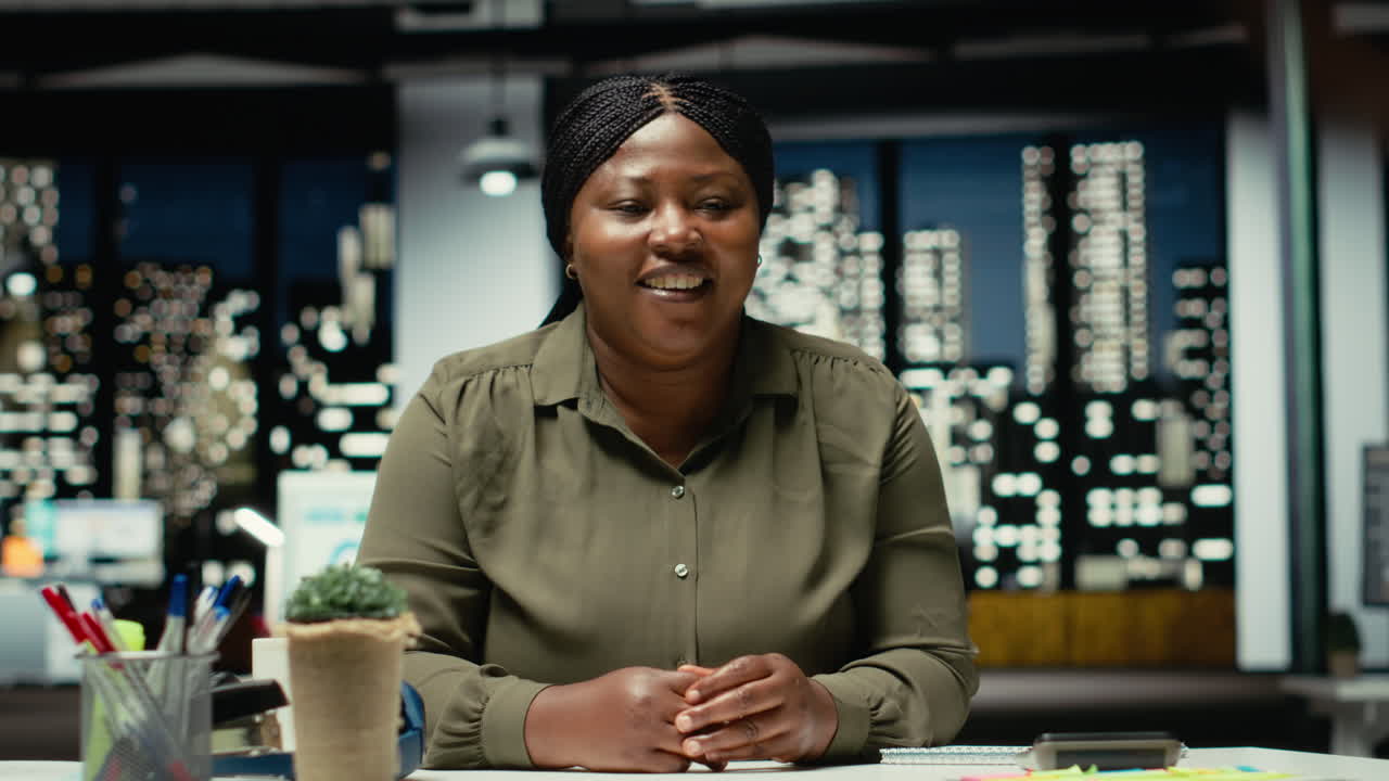 POV of business person greeting people on a video call network at office