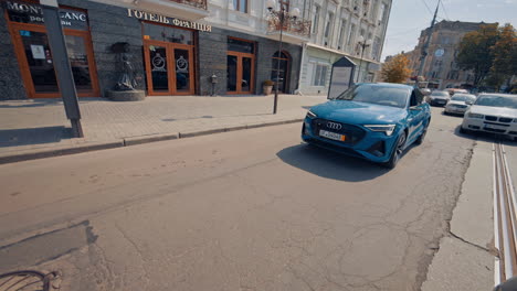 new stylish car on modern city street. urban city vehicle riding on them road.