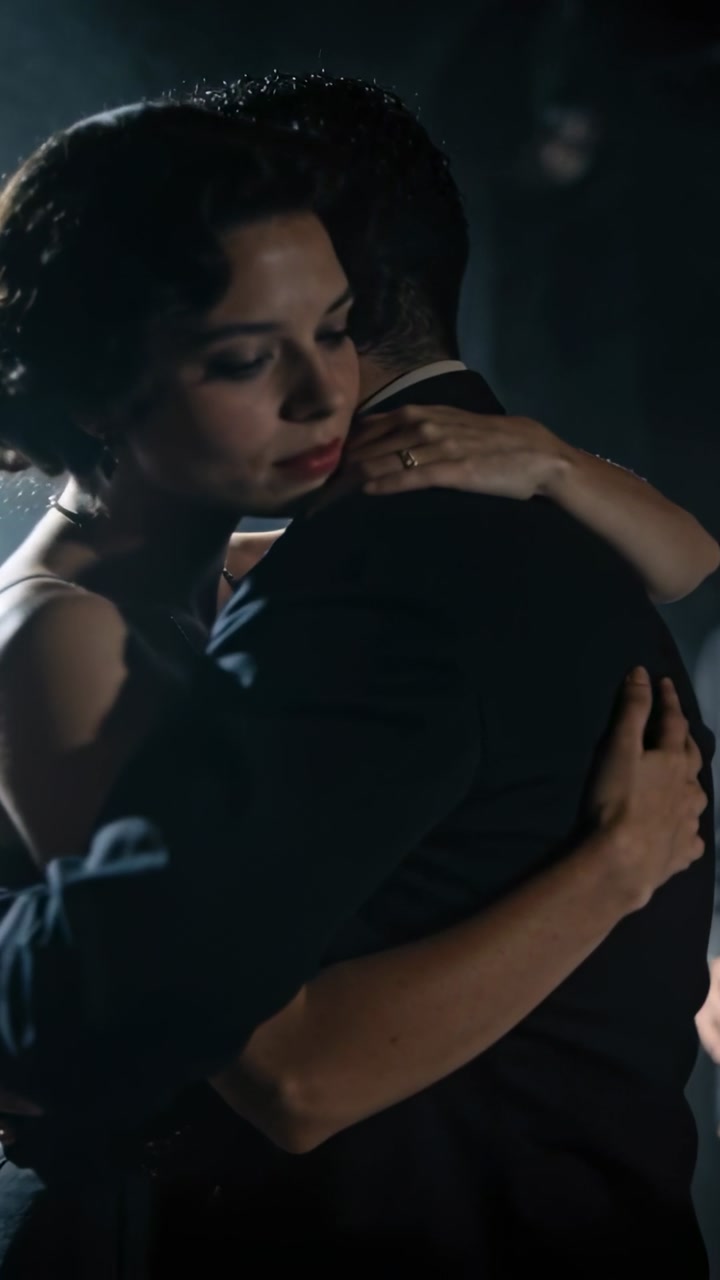 Elegant Couple Embracing and Slow Dancing in Dramatic Lighting