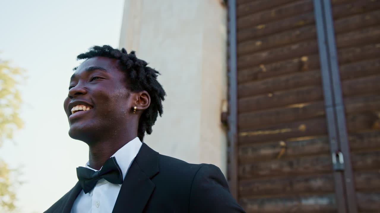Man in tuxedo smiling