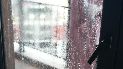 cleaning a window with a squeegee