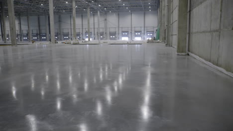 empty warehouse under construction with polished concrete floor