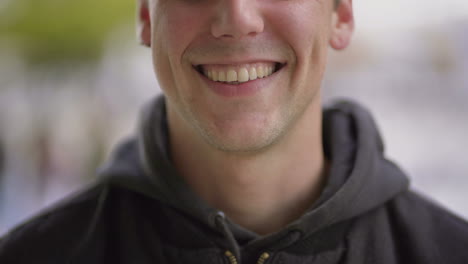 cropped shot of cheerful young man laughing