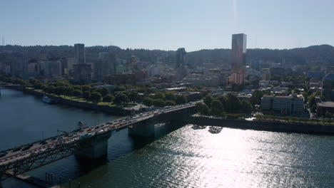 dolly forward and right over willamette river near susnet showing downtown