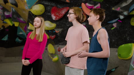 teenage friends in a climbing gym