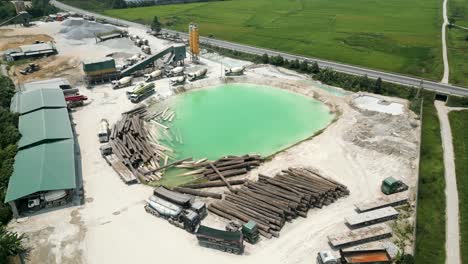 aerial view of a construction site and lumber yard with a concrete plant