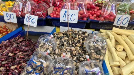 various produce displayed at a vibrant market stall