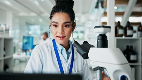 a scientist using a microscope in a laboratory