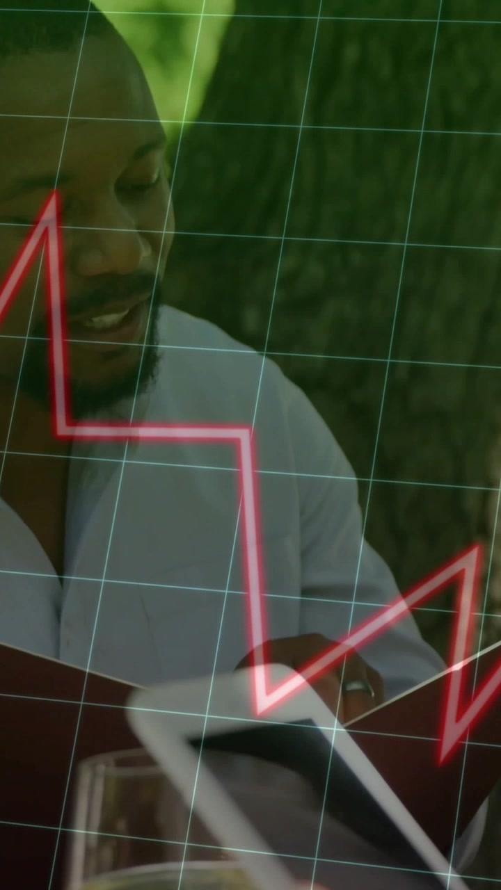 Adult man flipping menu while hand tapping phone, starting grid and red jagged line showing finance