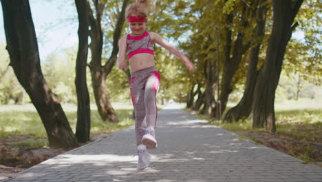 Athletic-fitness-sport-runner-child-girl-finishing-racing-competition,-champion-winning-marathon