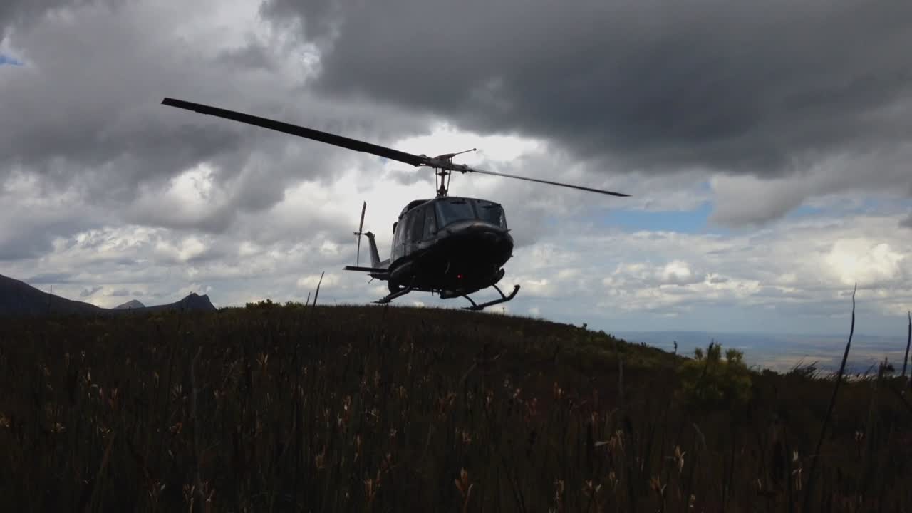 helicopter flying high in mountain