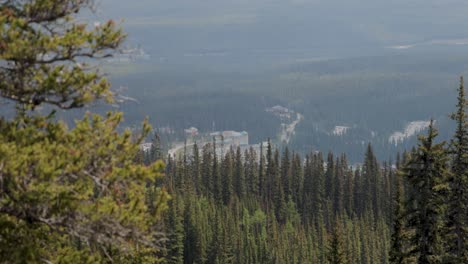 looking down on fairmont lake louise from the top of the hiking trail at lake agnes tea house on mount st. piran and mount whyte, within banff national park near lake louise alberta.