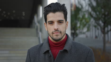 portrait of a man in a coat and turtleneck