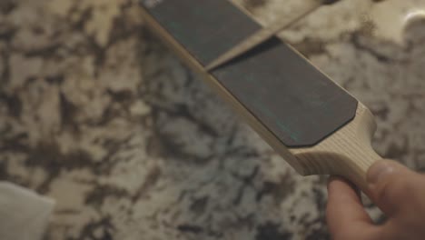 Sharpening-Knife-With-Leather-Strop-Sharpener-In-The-Kitchen