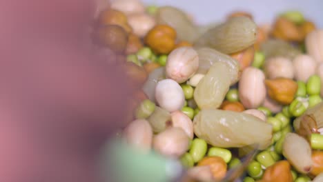 taking soak sprouts and nuts from tifinbox closeup view