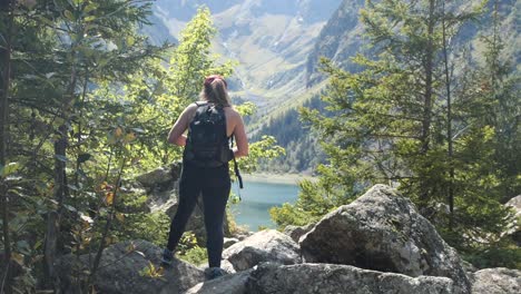 Stunning-handheld-shot-of-a-young-woman-coming-up-to-a-gorgeous-view-of-the-alps-of-France