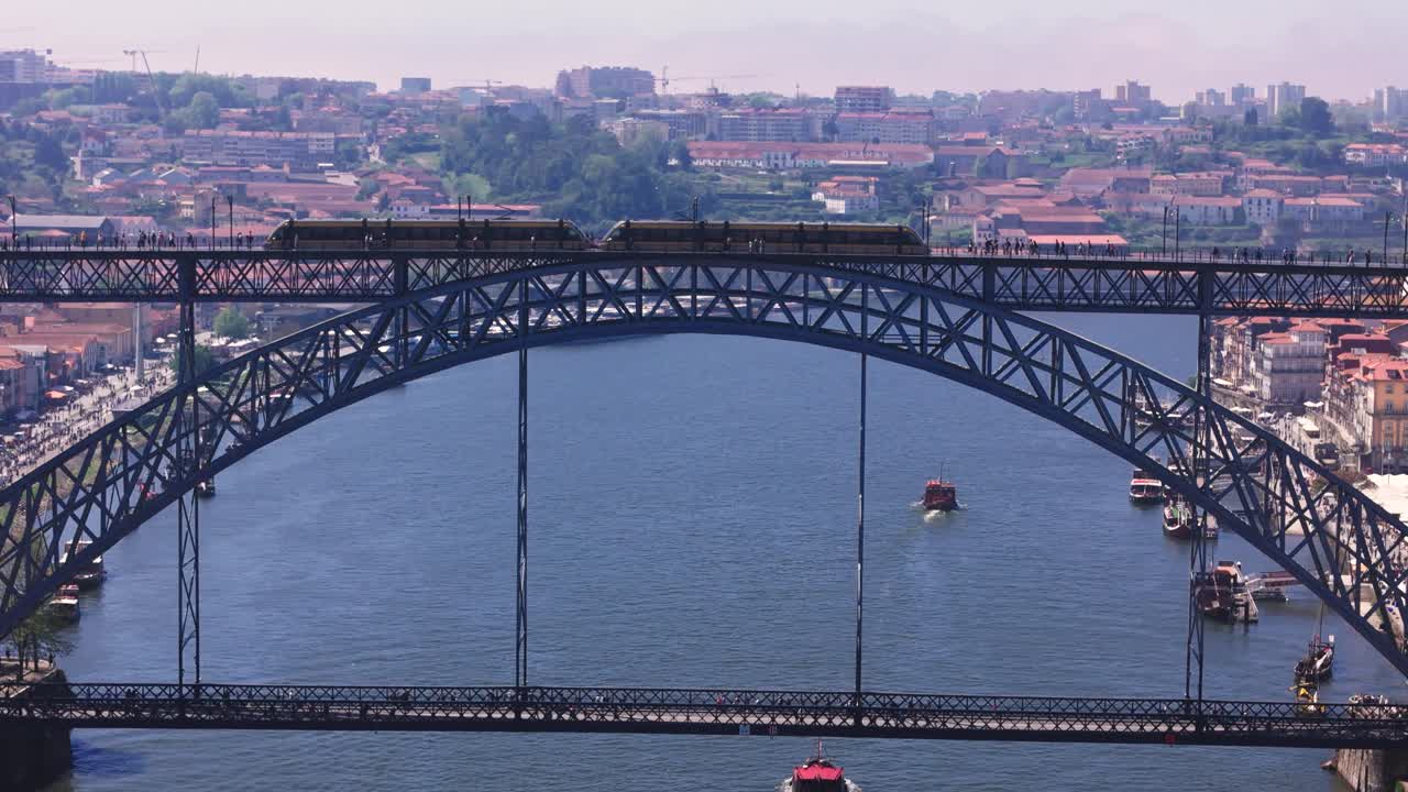 Fly towards Luís I Bridge while train passing by, Porto Portugal