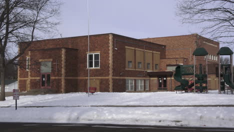 day exterior small school in the winter with snow