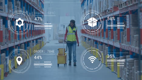 animation of data processing and media icons over biracial female worker walking in warehouse