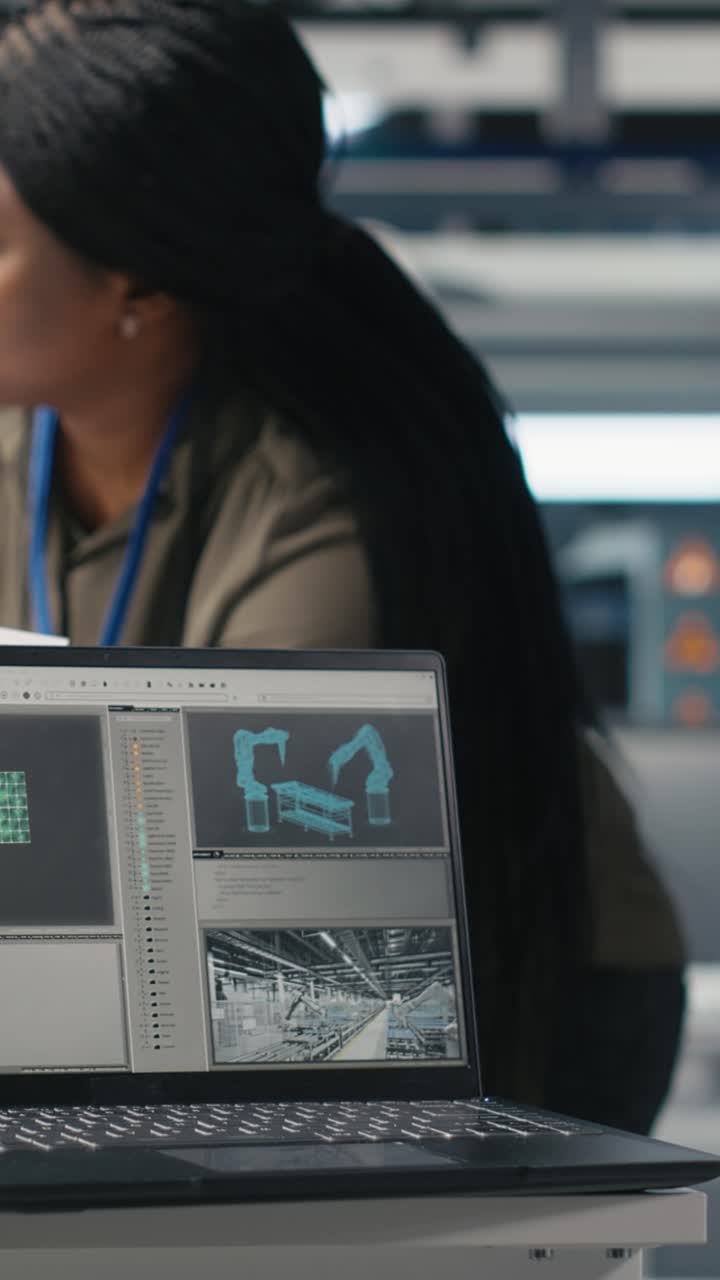 Vertical Video African American engineers doing teamwork on production line for solar panels
