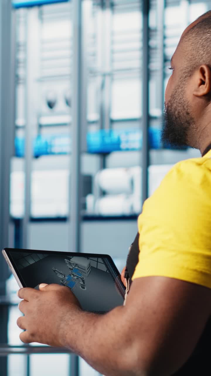 Vertical video Photovoltaic smart factory engineer uses CAD program on tablet