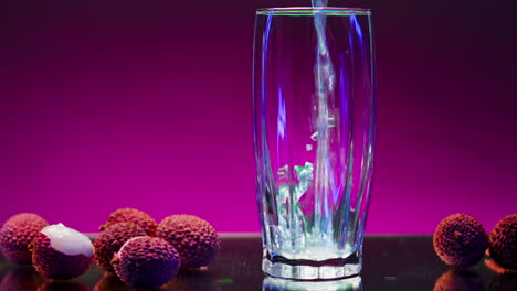 lychee juice pouring into glass