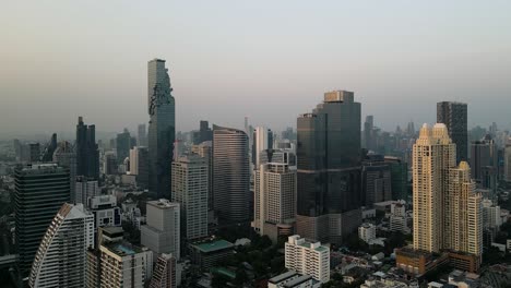 bangkok city sathorn skyline, stunning dense populated city aerial view, urban jungle cinematic aerial drone footage bustling metropolis