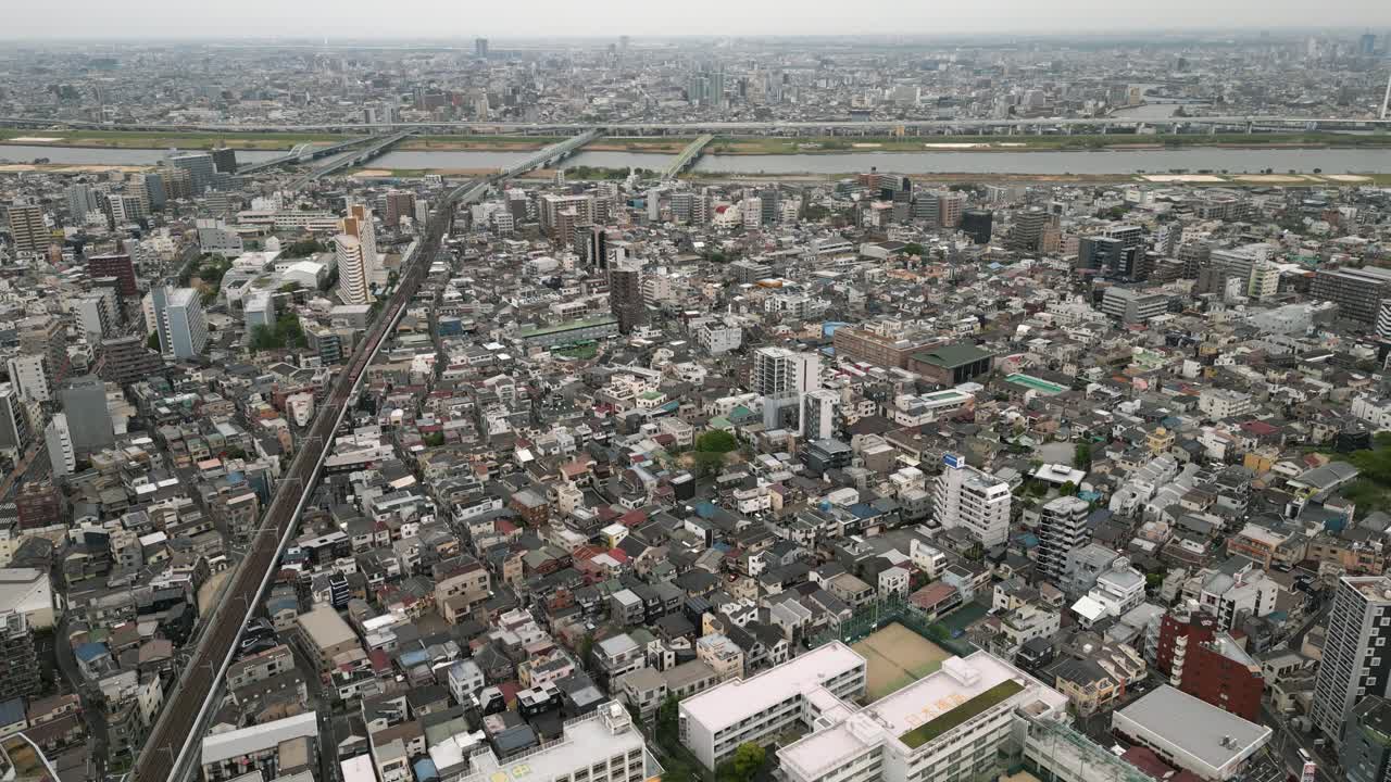 Aerial Scenic Urban Drone Footage of a neighborhood, streets and buildings in the Capital City of Tokyo, Japan during Sunset