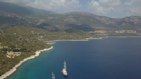 hazy turkish mediterranean sea coast with tall tour ships anchored