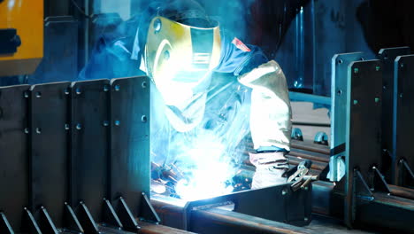 technician steel factory staff worker asian man work ironwork in a heavy industrial machine with safety engineer uniform
