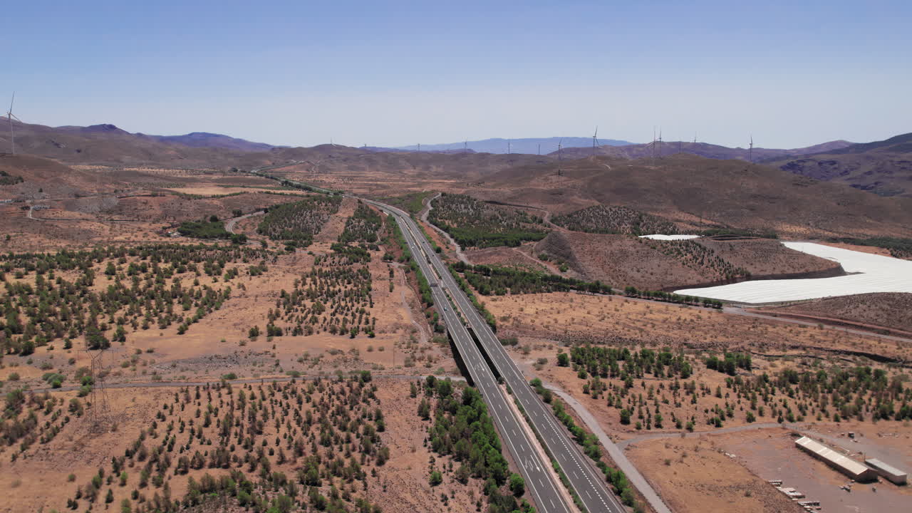 Drone flying near a highway on the outskirts of Granada, Spain